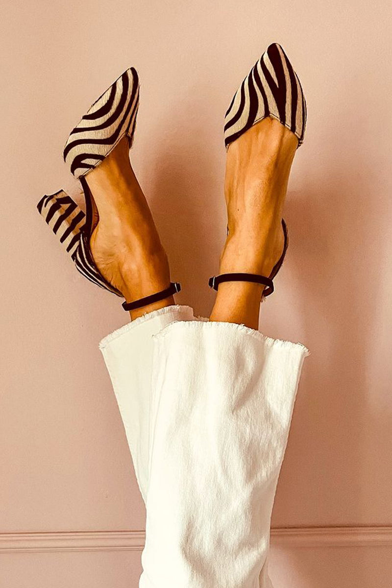 ZEBRINA – MID-HEEL STRIDE WITH WILD REFINEMENT