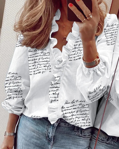 ENOLA – CHARMED WHIMSY RUFFLED BLOUSE